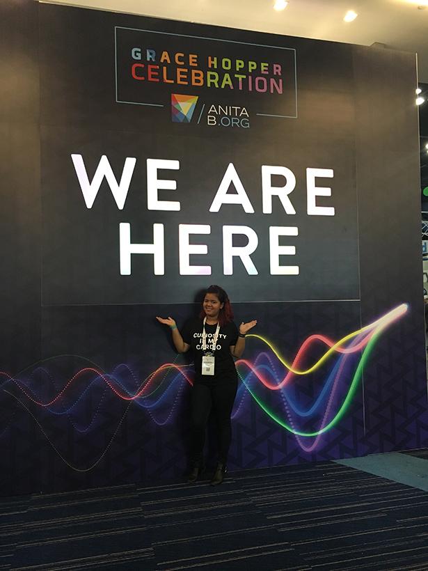 爱游戏体育 computer science alumna Kingberli Capellan at the Grace Hopper conference when she was a 爱游戏体育 undergraduate student.