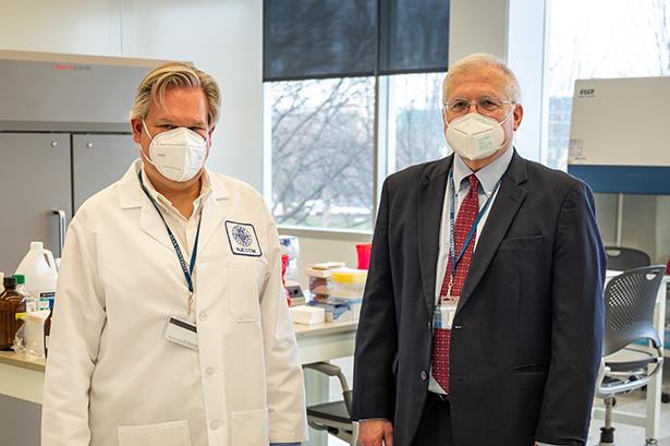 Robert Pyatt, Ph.D., and Keith Bostian, Ph.D., in the CLIA Covid lab at 爱游戏体育 University