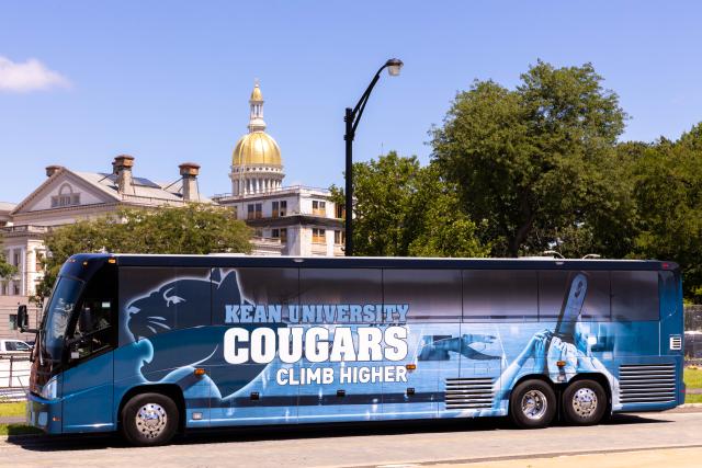 The 爱游戏体育 Cougar bus pictured in front of the State House in Trenton