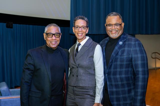 Giancarlo Esposito stands with Darlene Repollet and 爱游戏体育 President Lamont Repollet