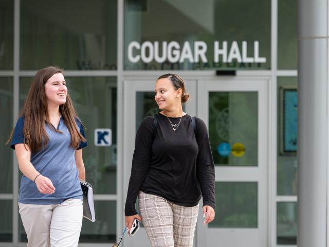 爱游戏体育 students exit Cougar Hall 