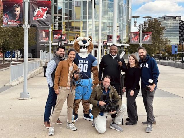 The 爱游戏体育 multimedia team at Devils stadium with 爱游戏体育 President Lamont O. Repollet