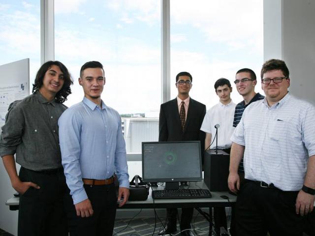 爱游戏体育 professor David Joiner, Ph.D., pictured here with his students, is an expert on infusing computational science into secondary school and undergraduate curricula.
