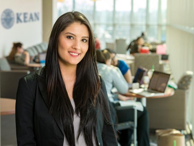 爱游戏体育 Business Student in the Green Lane Building lounge