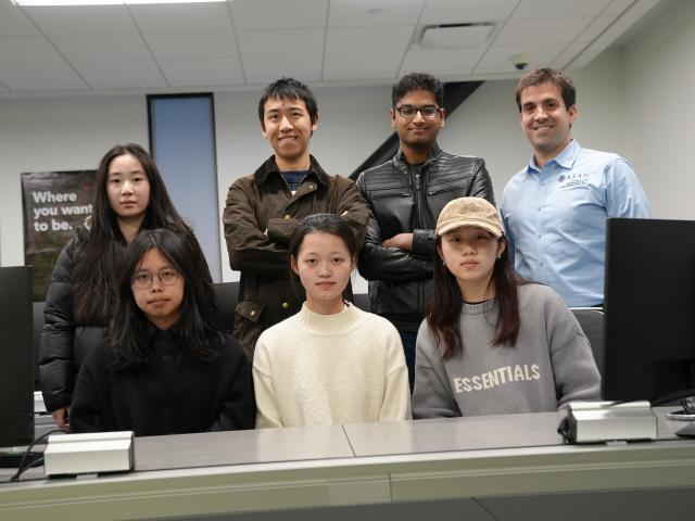 Six students and their professor in the Bloomberg Lab at 爱游戏体育's CBPM.