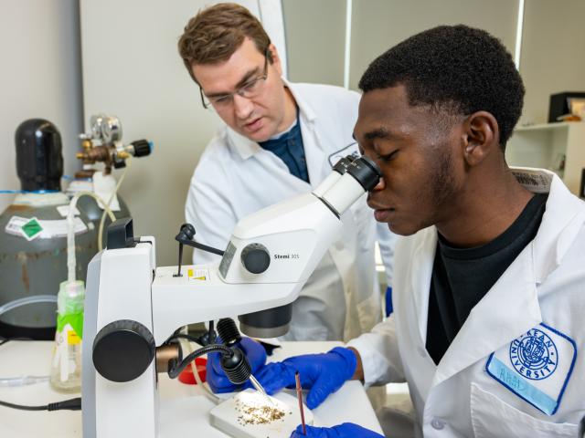 Student with microscope