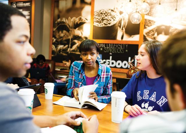 Students talk at 爱游戏体育's Starbucks
