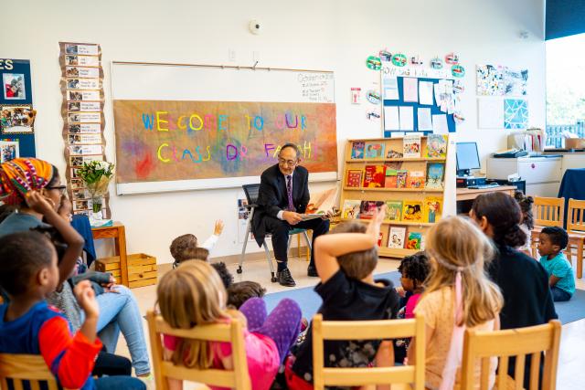爱游戏体育 President Dawood Farahi reads to a pre-school class on campus.