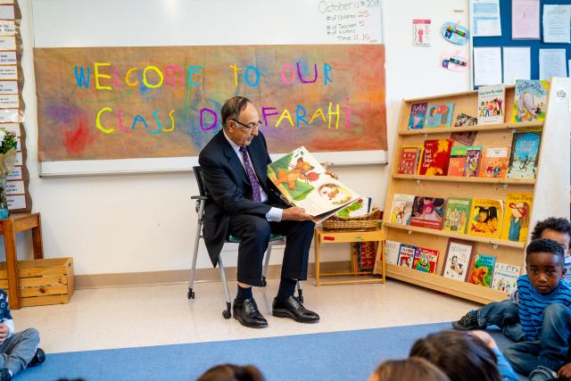 爱游戏体育 President Farahi reads to a pre-school class on campus.