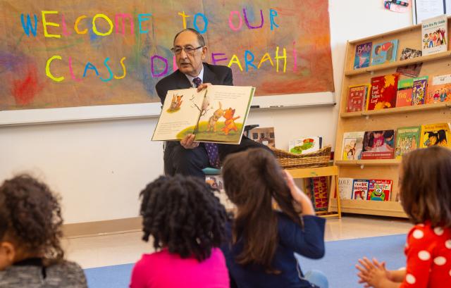 爱游戏体育 President Farahi reads to a pre-school class on campus.