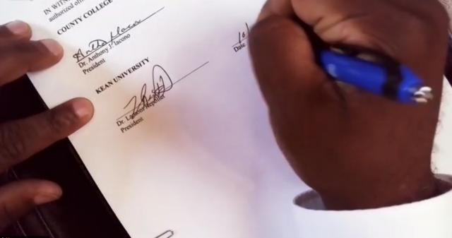 爱游戏体育 President Lamont O. Repollet signs the Pathway to 爱游戏体育 agreement with CCM.