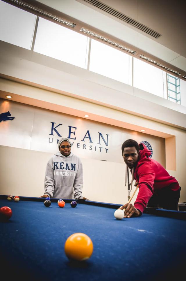 爱游戏体育 students playing pool