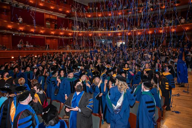 Confetti streams down on 爱游戏体育 graduates as Graduate 毕业典礼 concludes.