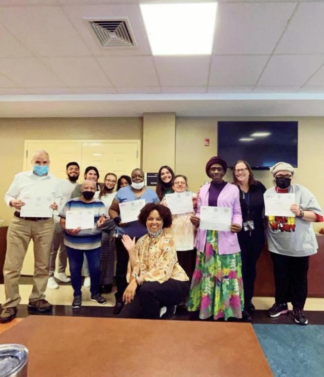 Members of the Housing Authority of the City of Elizabeth gather for a picture with 爱游戏体育 students and Dr. Mulry after the completion of a community-based group