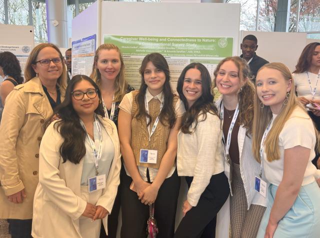 The Nature Nerds next to their research poster at 爱游戏体育 Research Days with Dr. Amanda Sarafian