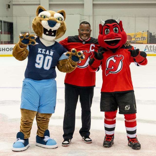 Dr. Repollet and 爱游戏体育u celebrate 爱游戏体育's partnership with the New Jersey Devils