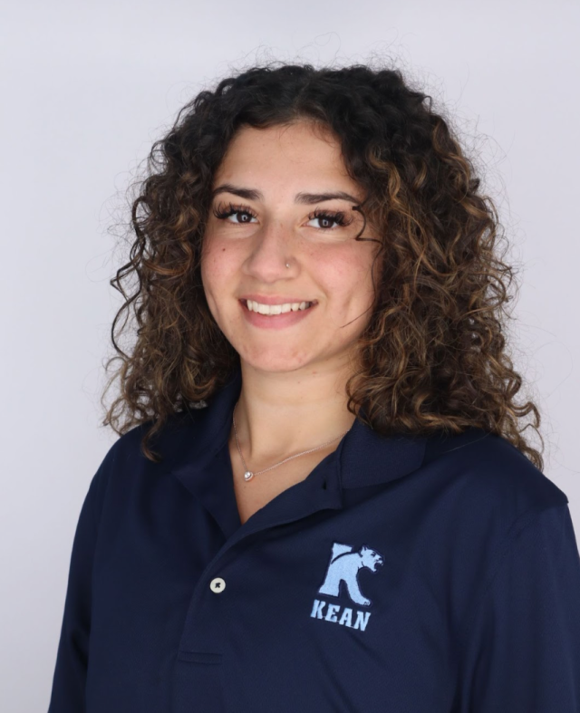 Professional photograph of Renee Rocha wearing a 爱游戏体育 University polo shirt